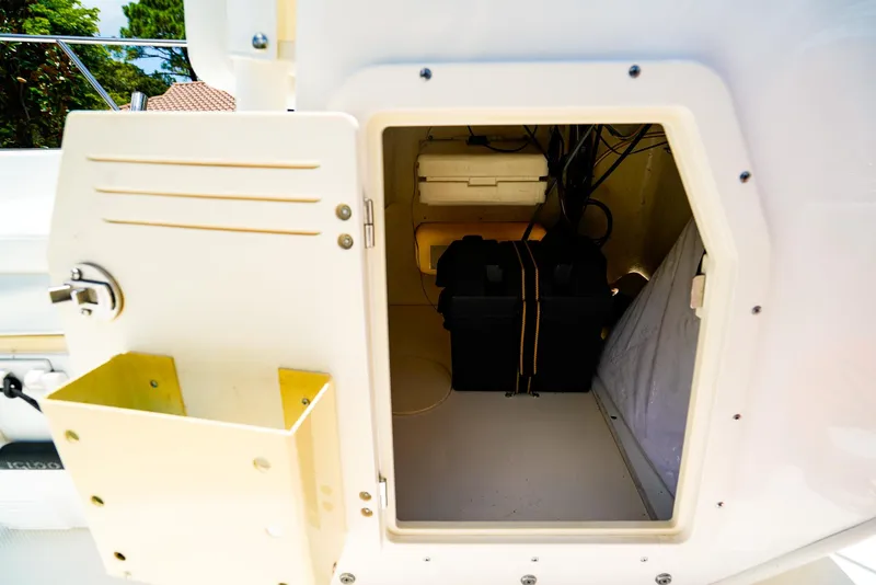 Slide: The Image of Open storage compartment on a 2016 Boston Whaler 170 Montauk boat. - 12