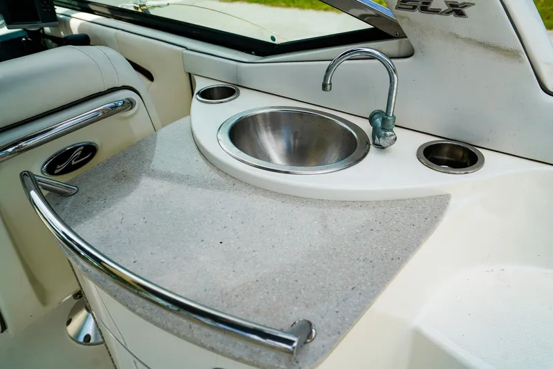 Slide: The Image of 2010 Sea Ray 270 SLX boat interior with sink and countertop. - 14