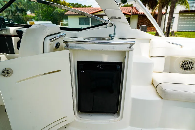 Slide: The Image of Interior of 2010 Sea Ray 270 SLX boat with sink and mini fridge. - 15
