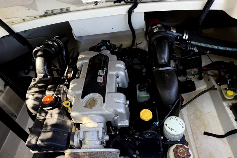 Slide: The Image of Engine compartment of a 2010 Sea Ray 270 SLX boat, featuring an 8.2 MAG engine. - 30