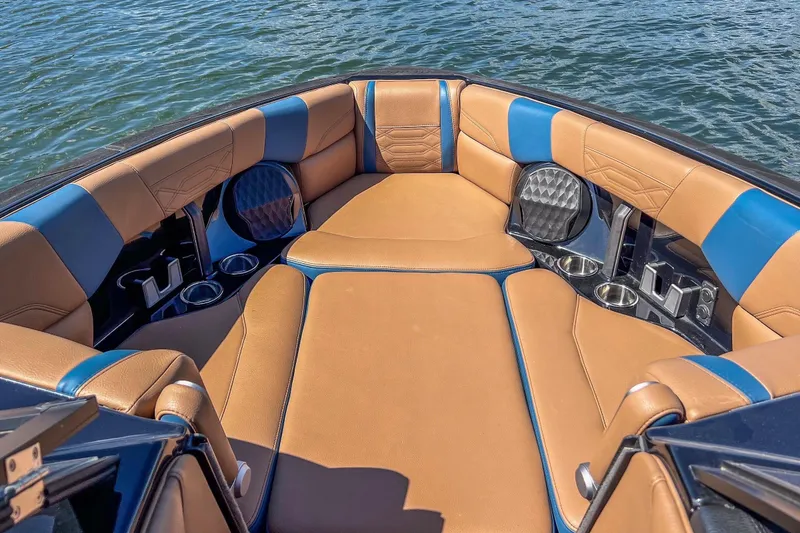 Slide: The Image of Luxurious interior of 2022 Malibu Wakesetter 25 LSV boat with tan and blue seating. - 14