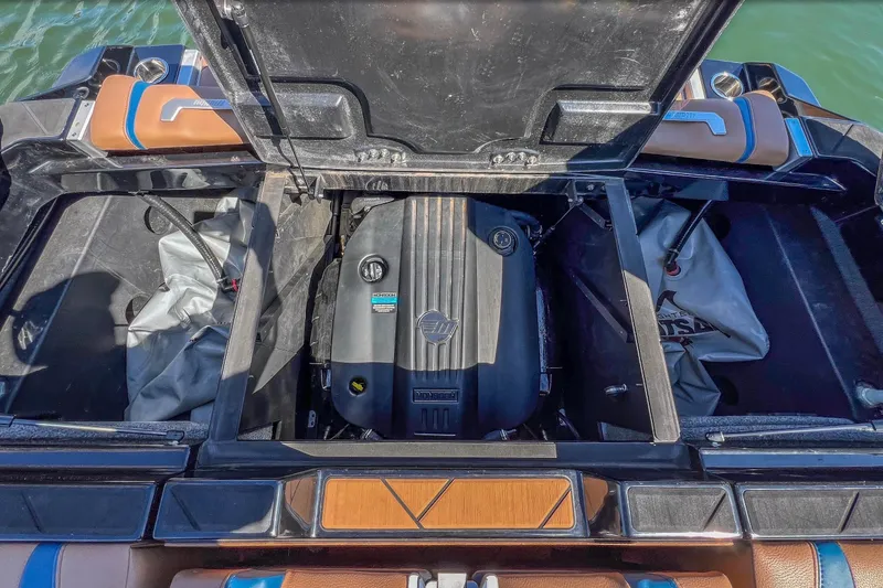 Slide: The Image of 2022 Malibu Wakesetter 25 LSV engine compartment with open hatch, showcasing interior details. - 16