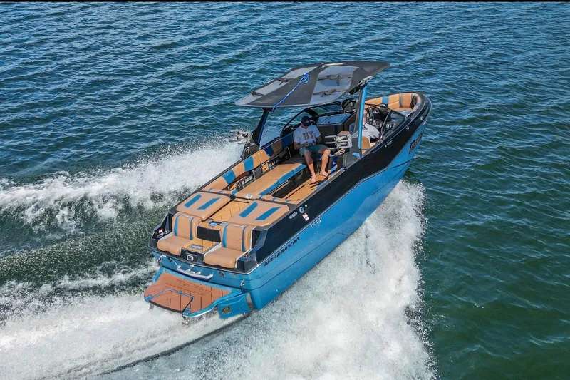 Slide: The Image of 2022 Malibu Wakesetter 25 LSV cruising on open water, showcasing sleek design and performance. - 5