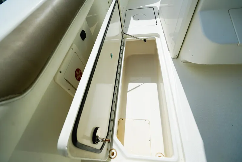 Slide: The Image of Open storage compartment on 2018 World Cat 320 CC boat, showcasing interior space. - 16