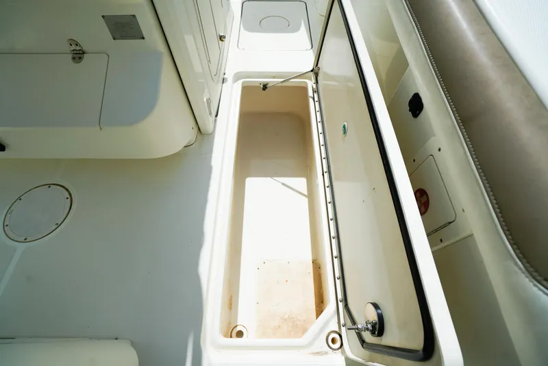Slide: The Image of Open storage compartment on 2018 World Cat 320 CC boat deck. - 17