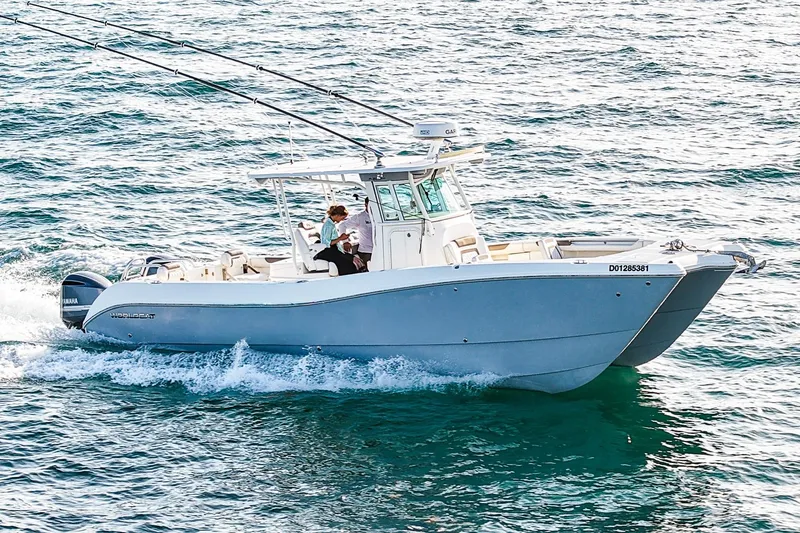 Slide: The Image of 2018 World Cat 320 CC boat cruising on open water. - 3