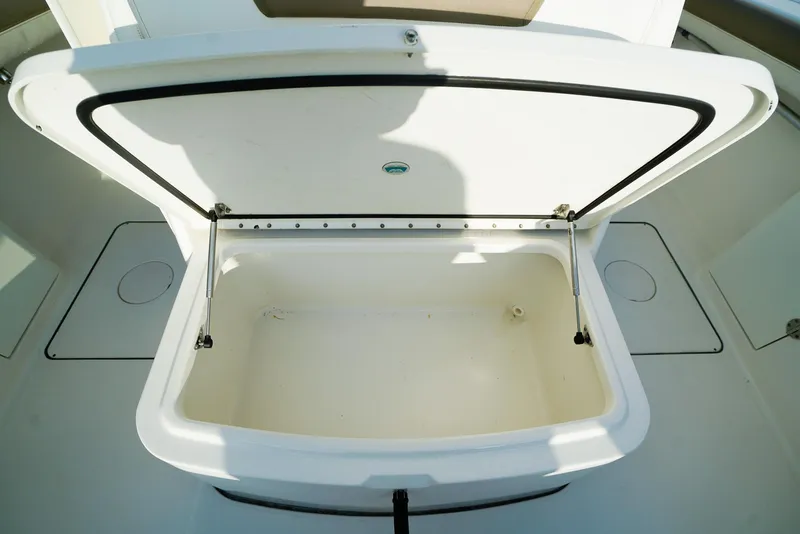 Slide: The Image of Open storage compartment on 2018 World Cat 320 CC boat. - 37