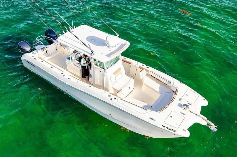 Slide: The Image of 2018 World Cat 320 CC boat on clear green water, aerial view. - 4