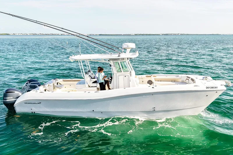 Slide: The Image of 2018 World Cat 320 CC boat cruising on clear blue ocean waters. - 40