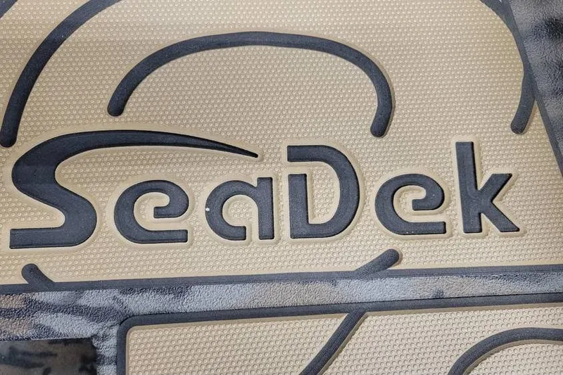 Slide: The Image of SeaDek logo on Xpress H20B Bay boat, 2026 model, featuring textured surface. - 11