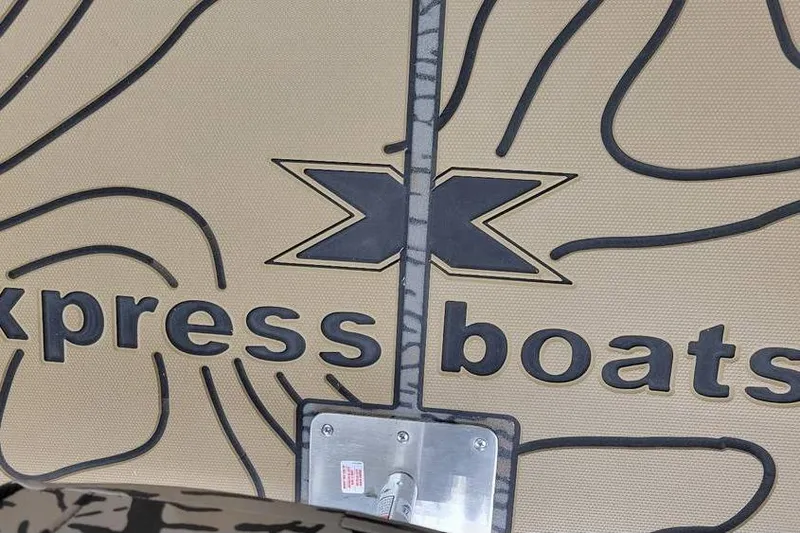 Slide: The Image of 2026 Xpress H20B Bay boat logo and design detail. - 12