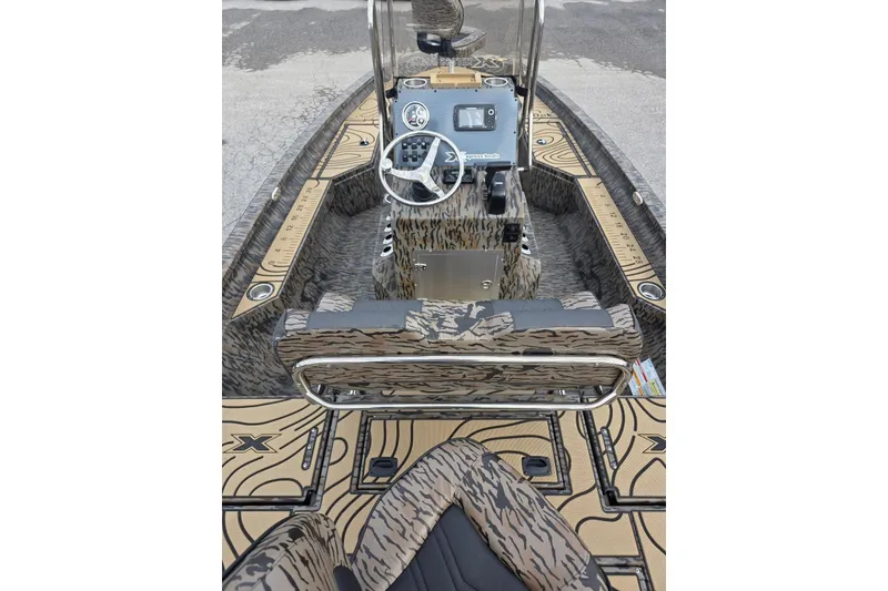Slide: The Image of 2026 Xpress H20B Bay boat interior with camouflage design and modern dashboard. - 29