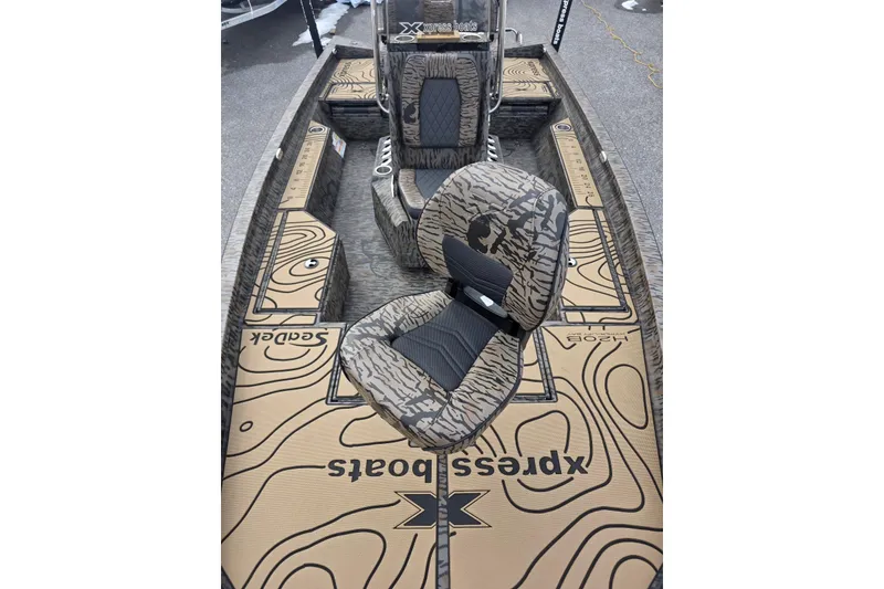 Slide: The Image of 2026 Xpress H20B Bay boat interior with custom seating and topographic design. - 36