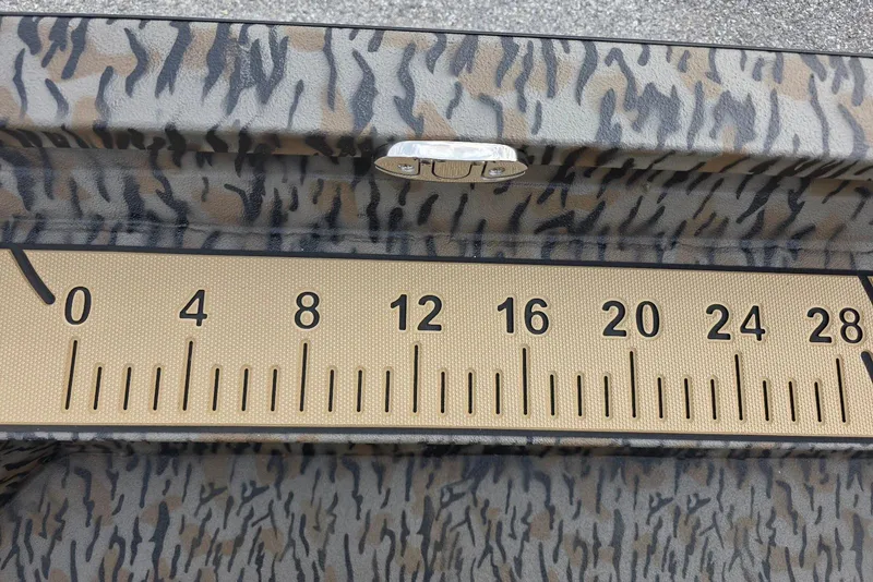 Slide: The Image of Camouflage-patterned ruler on 2026 Xpress H20B Bay boat surface. - 41