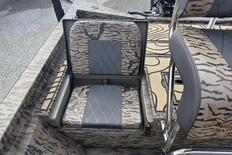Slide: The Image of 2026 Xpress H20B Bay boat with camouflage seating and sleek design. - 44