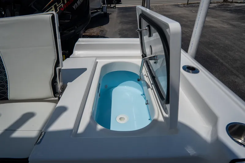 Slide: The Image of 2026 Tidewater 2410 Bay Max boat with open livewell compartment. - 13