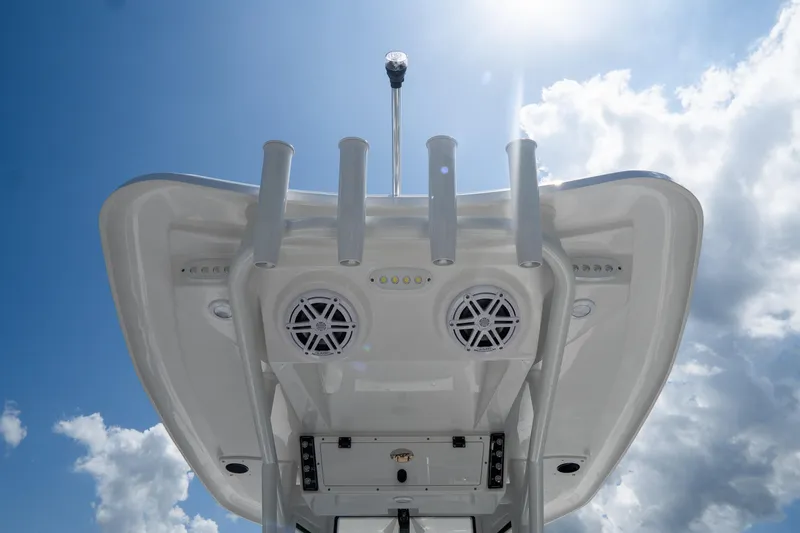 Slide: The Image of Tidewater 2410 Bay Max 2026 boat top view with speakers and rod holders under sunny sky. - 15