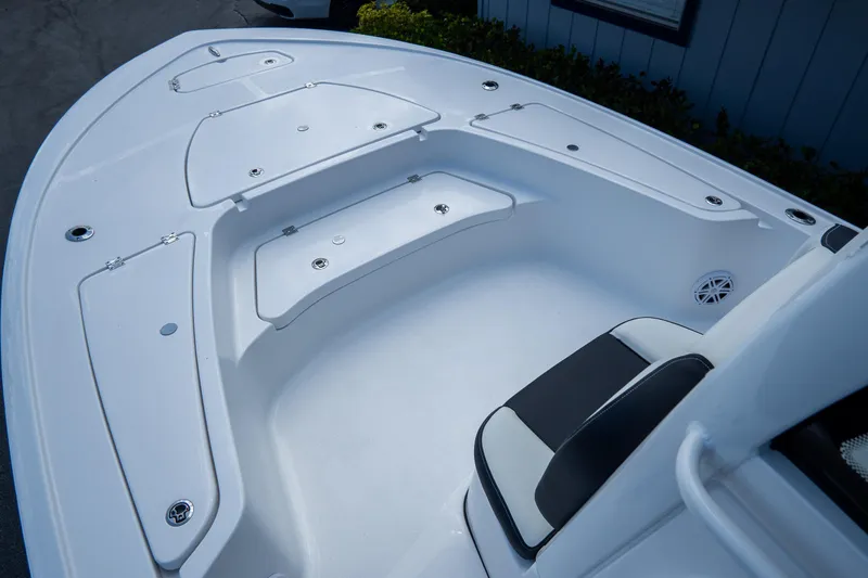 Slide: The Image of 2026 Tidewater 2410 Bay Max boat interior with seating and storage compartments. - 26