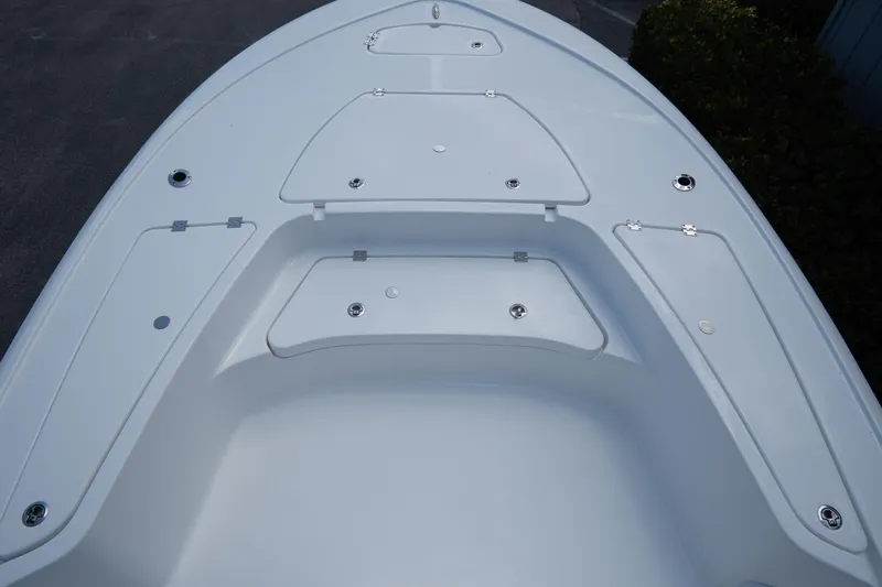 Slide: The Image of 2026 Tidewater 2410 Bay Max boat deck with storage compartments and sleek design. - 27