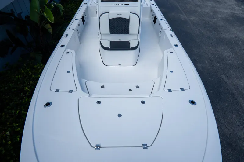 Slide: The Image of 2026 Tidewater 2410 Bay Max boat deck, featuring spacious seating and storage compartments. - 28