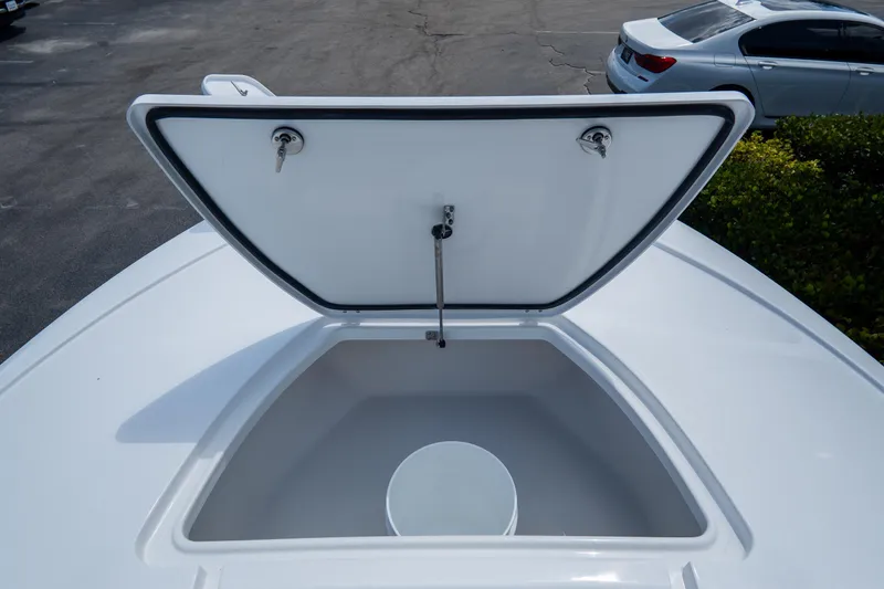 Slide: The Image of Open storage compartment on 2026 Tidewater 2410 Bay Max boat, showing interior space. - 32