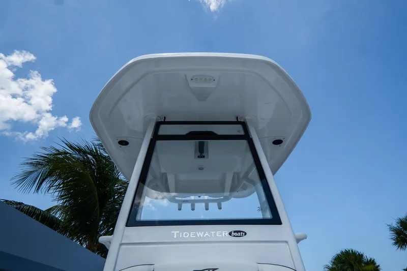Slide: The Image of 2026 Tidewater 2410 Bay Max boat against a clear blue sky. - 40