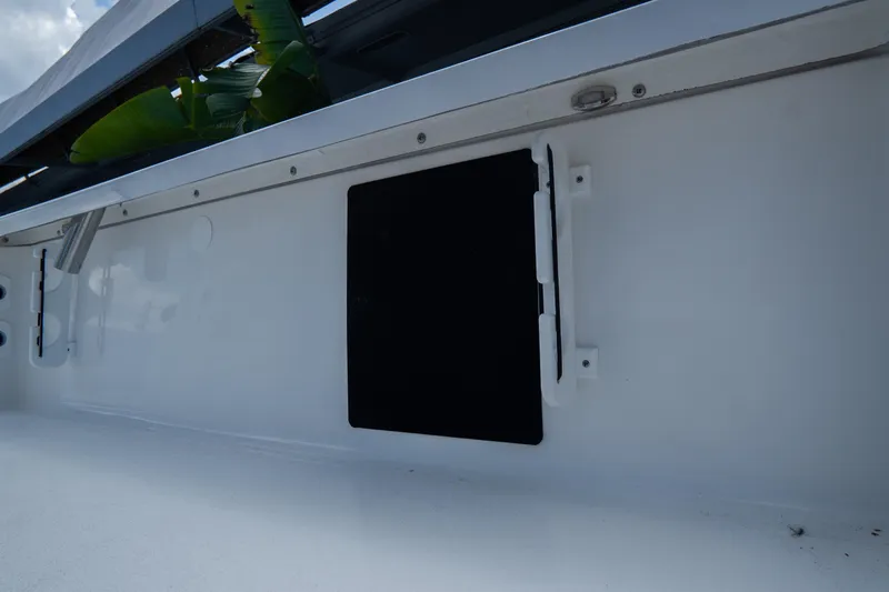 Slide: The Image of 2026 Tidewater 2410 Bay Max boat interior detail with sleek white finish. - 43