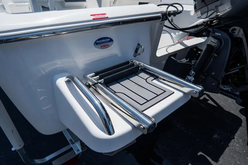 Slide: The Image of 2026 Tidewater 2410 Bay Max boat with stainless steel swim ladder and Yamaha engine. - 6
