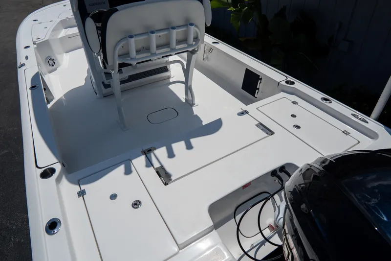 Slide: The Image of 2026 Tidewater 2410 Bay Max boat interior with seating and storage compartments. - 7