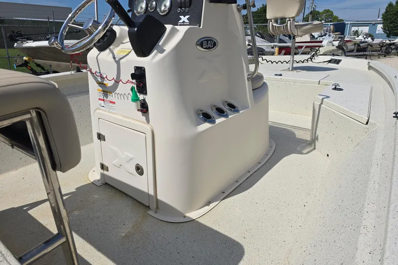 Slide: The Image of 2017 Xpress H20B Bay boat interior with steering console and seating. - 13