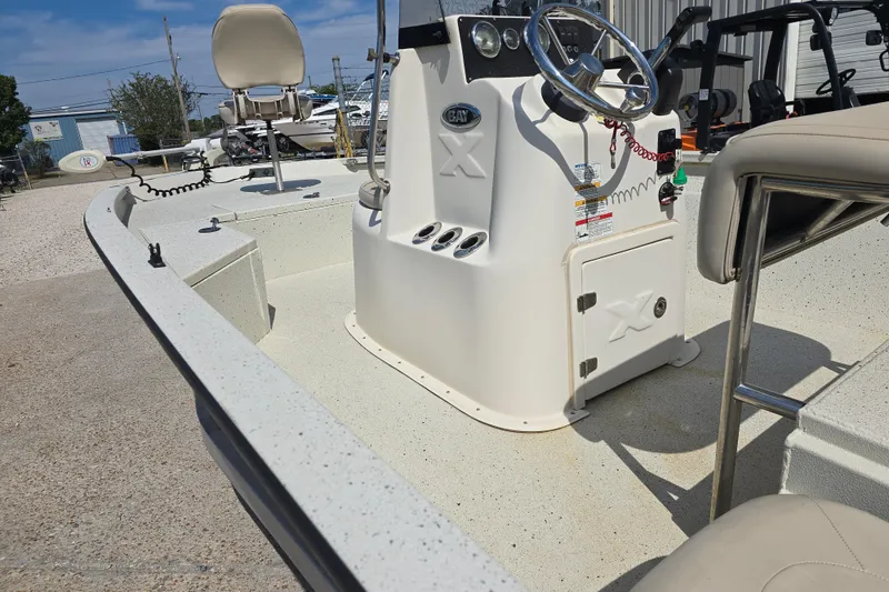 Slide: The Image of 2017 Xpress H20B Bay boat interior with steering console and seating. - 14