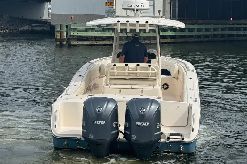 Slide: The Image of 2021 Grady-White Canyon 271 boat with dual Yamaha 300 engines on water. - 10