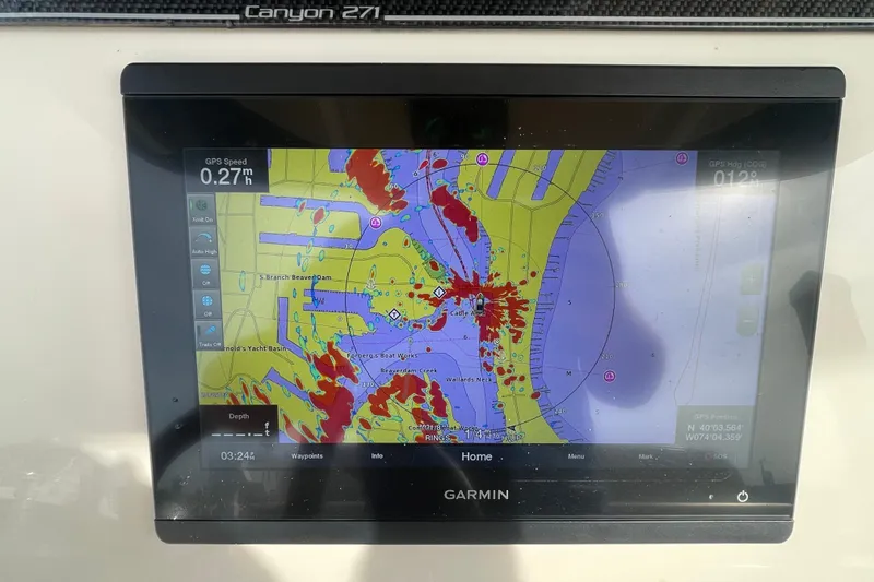 Slide: The Image of Garmin navigation display on 2021 Grady-White Canyon 271 boat, showing nautical chart. - 26