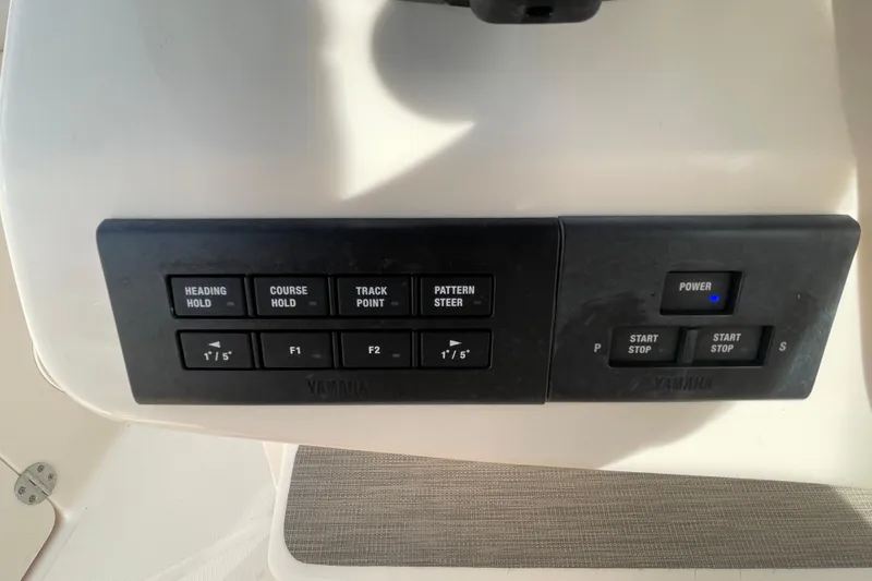 Slide: The Image of Control panel of a 2021 Grady-White Canyon 271 boat with Yamaha buttons. - 31