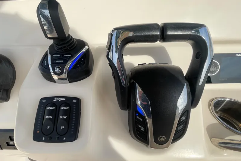 Slide: The Image of Control panel of 2021 Grady-White Canyon 271 boat with joystick and throttle. - 32