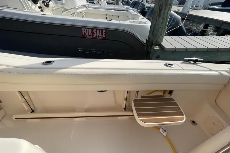 Slide: The Image of 2021 Grady-White Canyon 271 boat interior with seating and dock view. - 36