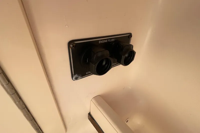 Slide: The Image of Engine flush system on 2021 Grady-White Canyon 271 boat. - 42