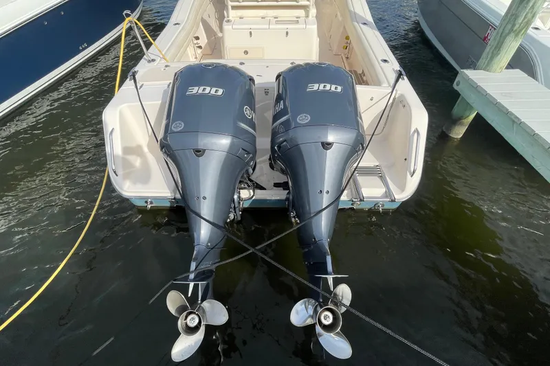 Slide: The Image of 2021 Grady-White Canyon 271 boat with dual Yamaha 300 engines docked. - 49