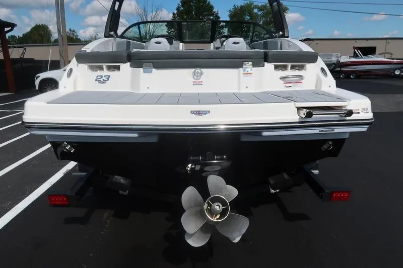 Slide: The Image of 2026 Chaparral 23 SSi logo on white boat exterior. - 12