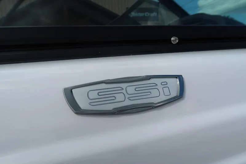 Slide: The Image of Rear view of 2026 Chaparral 23 SSi boat on trailer, showcasing propeller and sleek design. - 14