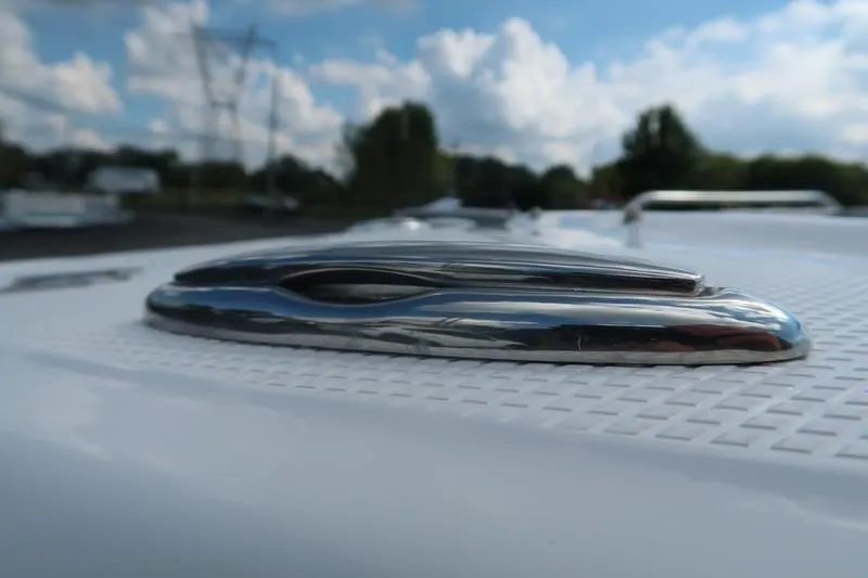 Slide: The Image of Close-up of 2026 Chaparral 23 SSi emblem on a sleek surface. - 19