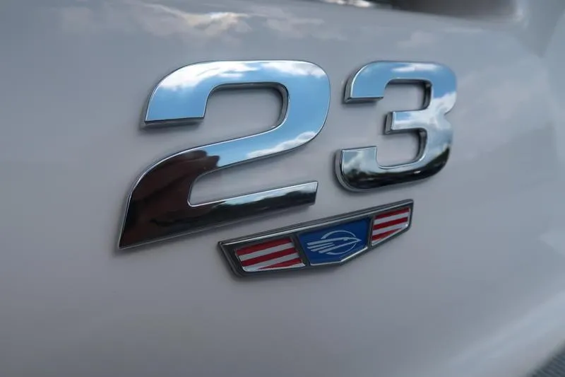 Slide: The Image of Interior view of 2026 Chaparral 23 SSi boat with gray and white seating. - 21