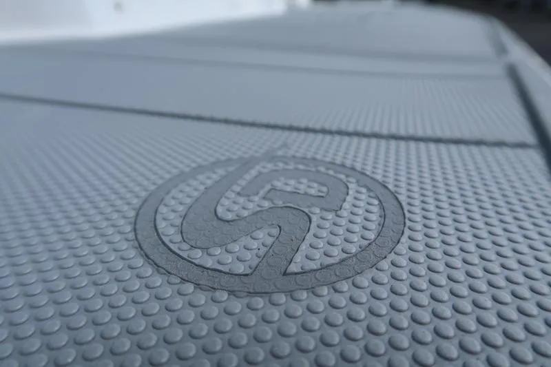 Slide: The Image of 2026 Chaparral 23 SSi boat storage compartment with blue interior and sleek design. - 22