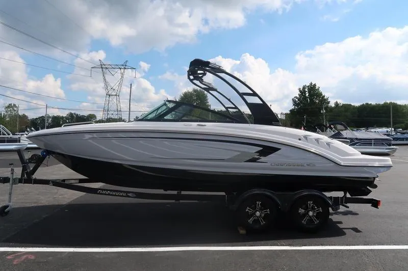 Slide: The Image of 2026 Chaparral 23 SSi boat interior with gray seating and speaker. - 34