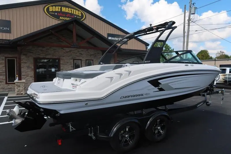 Slide: The Image of 2026 Chaparral 23 SSi boat on trailer at dealership, sunny day. - 4