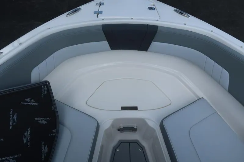 Slide: The Image of 2026 Chaparral 23 SSi boat interior with cushioned seating and sleek design. - 40