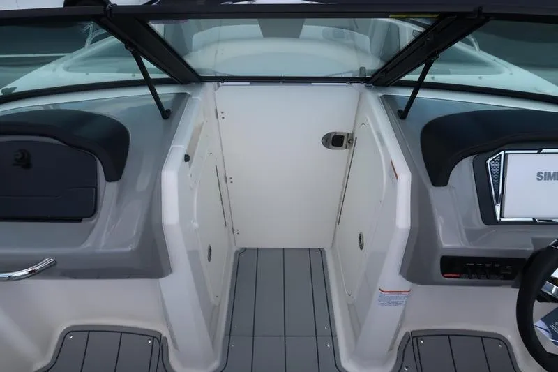 Slide: The Image of 2026 Chaparral 23 SSi boat interior with steering wheel and modern dashboard. - 41