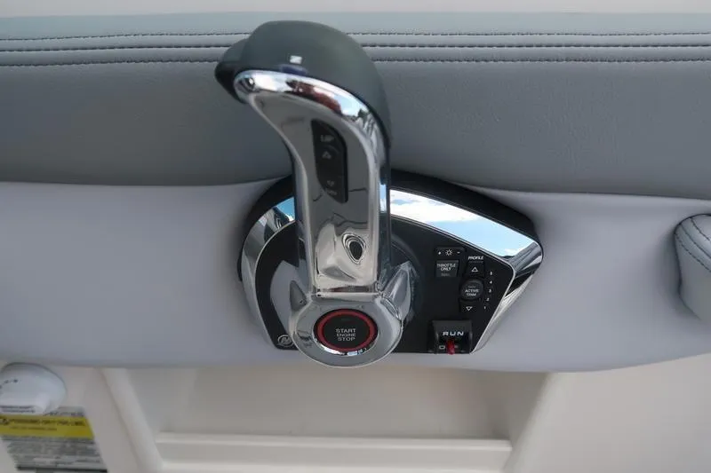 Slide: The Image of Control panel of 2026 Chaparral 23 SSi boat with switches and warning label. - 43