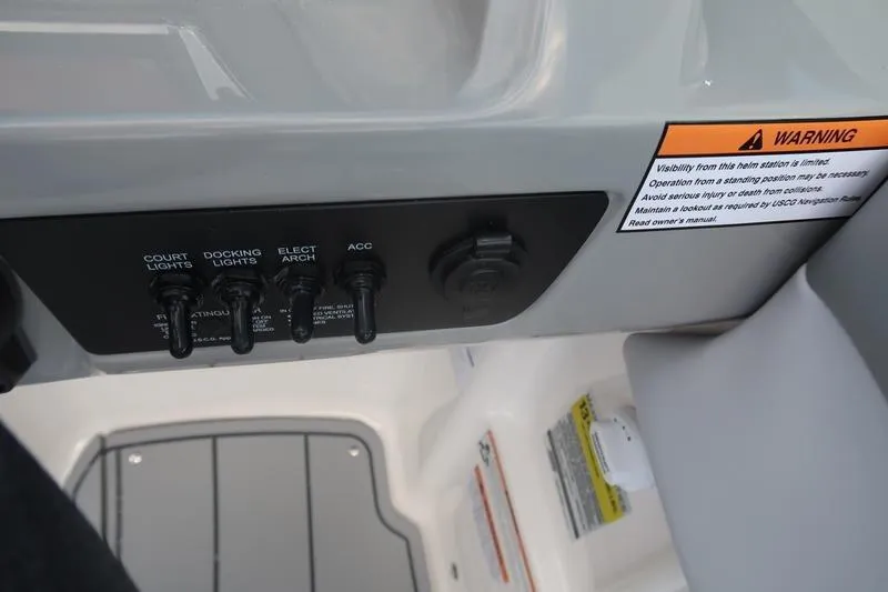 Slide: The Image of Open storage compartment on 2026 Chaparral 23 SSi boat, featuring sleek design and durable materials. - 44