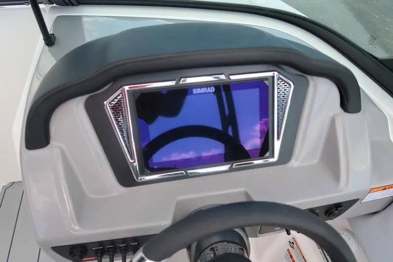 Slide: The Image of 2026 Chaparral 23 SSi boat interior with open storage compartment and sleek design. - 47